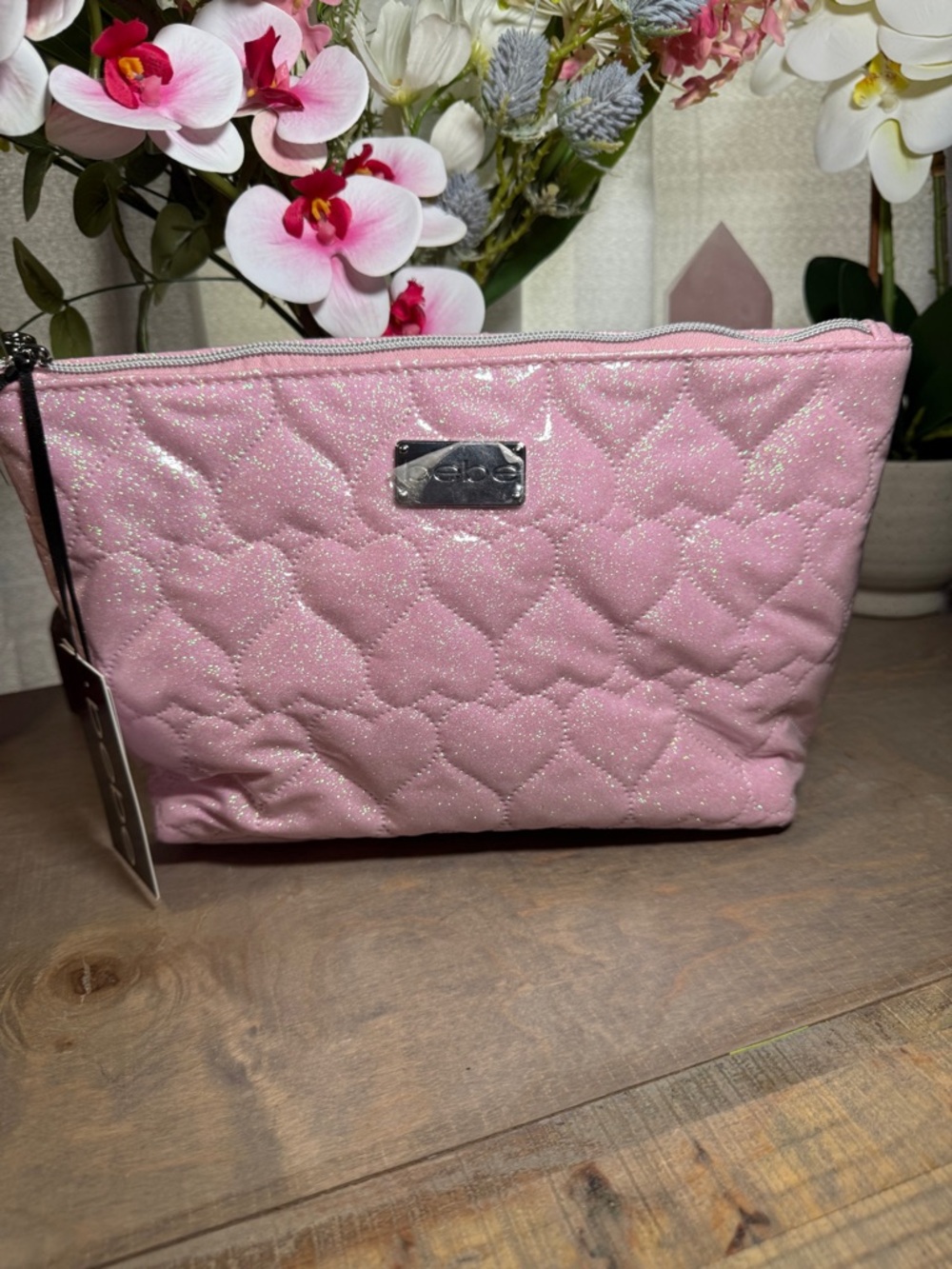 NWT Bebe and features a heart pattern and glittery finish.